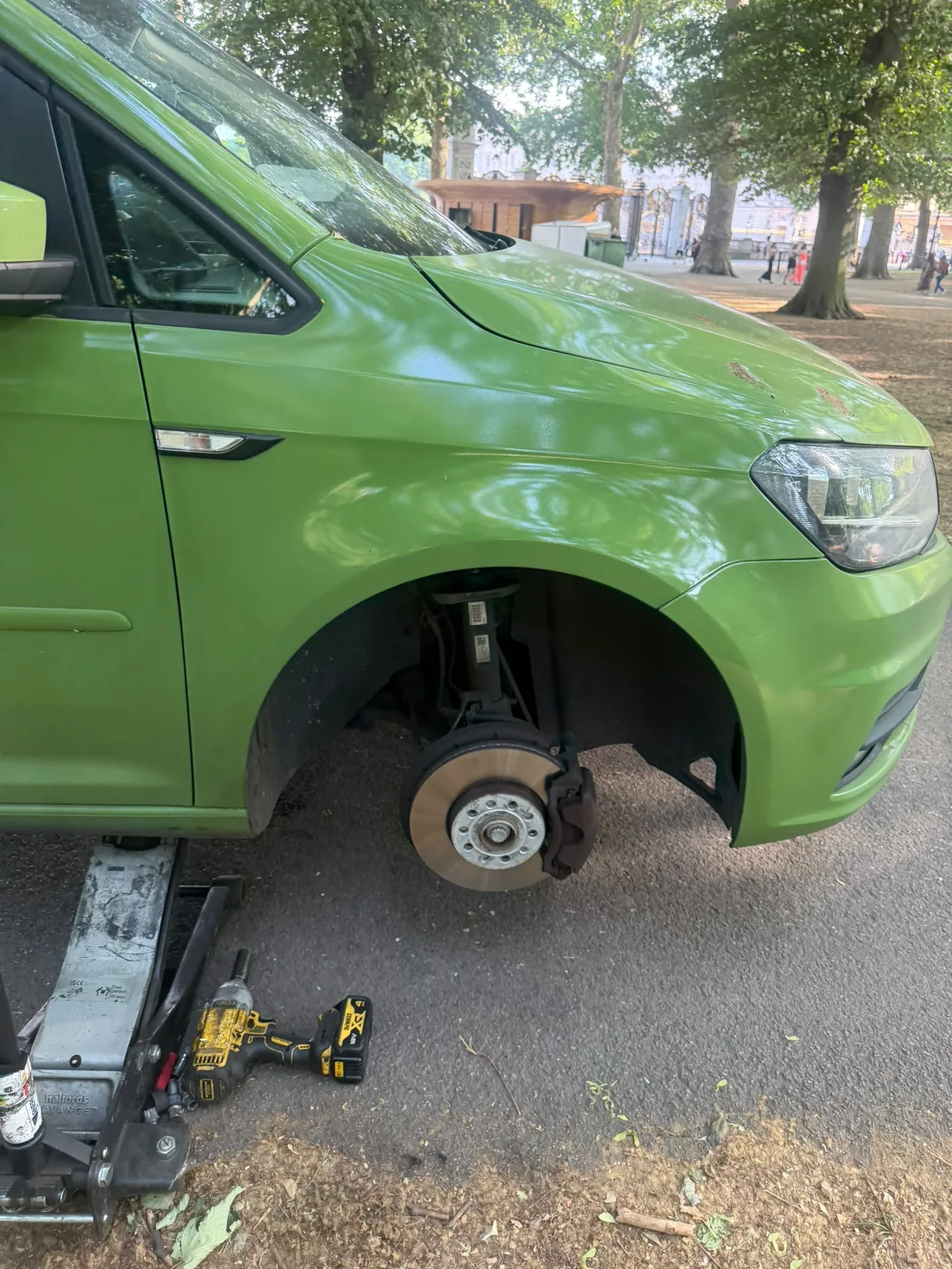 Technician fitting a tyre at a customer's location in Epsom